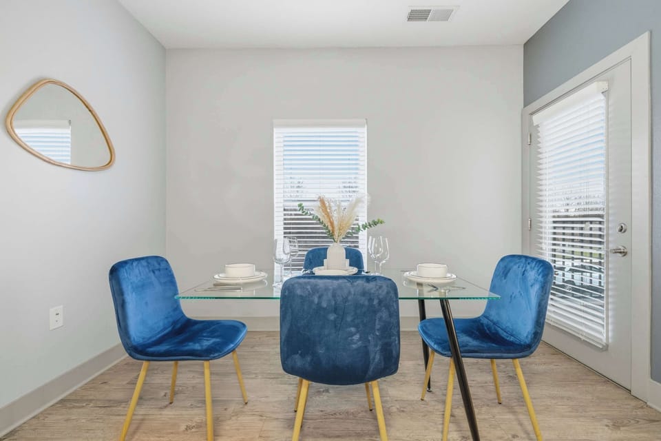 Modern dining nook with seating for four and natural light