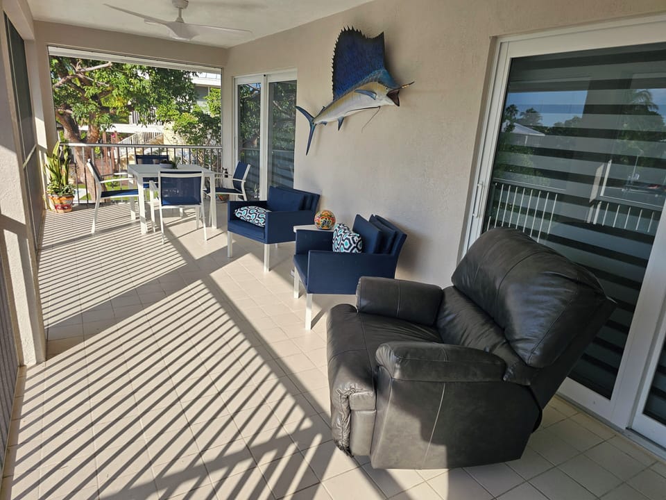 Beautiful Screened In Porch Overlooking Pool and Water, Sit Back and Enjoy!