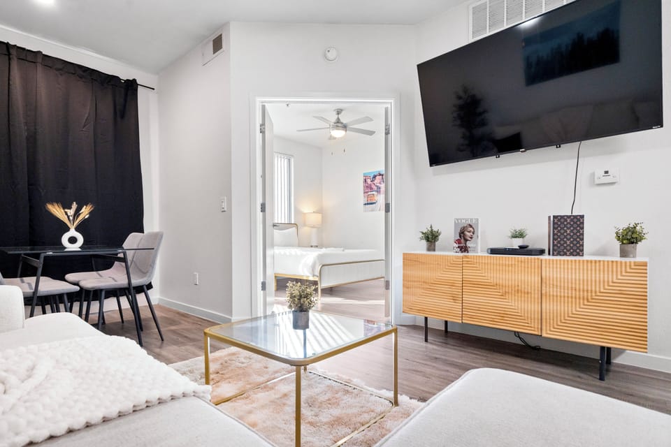 Luxury Apartment, 1 Queen Bed, Pets Allowed | Living room | 65-inch Smart TV with digital channels, foosball, streaming services