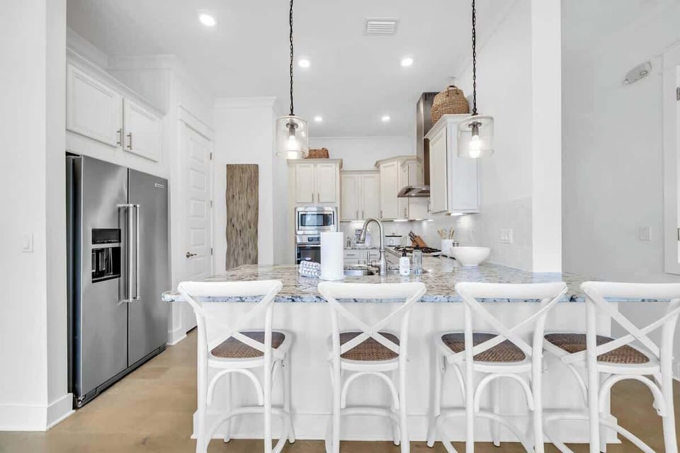 Fully stocked kitchen with island seating for 4.