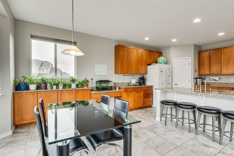 Dining Area | Glass Table | Pendant Lighting & Island Proximity