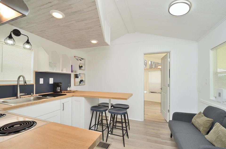 Cozy kitchen corner w/ bar seating & open layout for easy conversation
