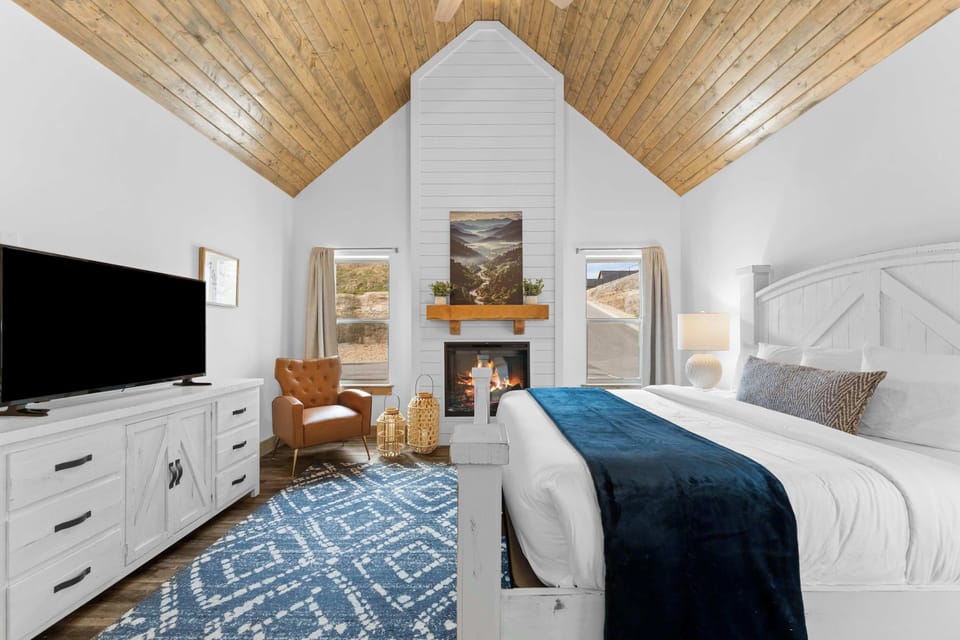 Bedroom 1 adds luxury to your stay with a king bed and its own fireplace!