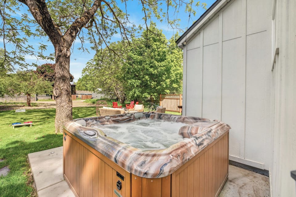 Soak, unwind, and let the day melt away in your private backyard hot tub