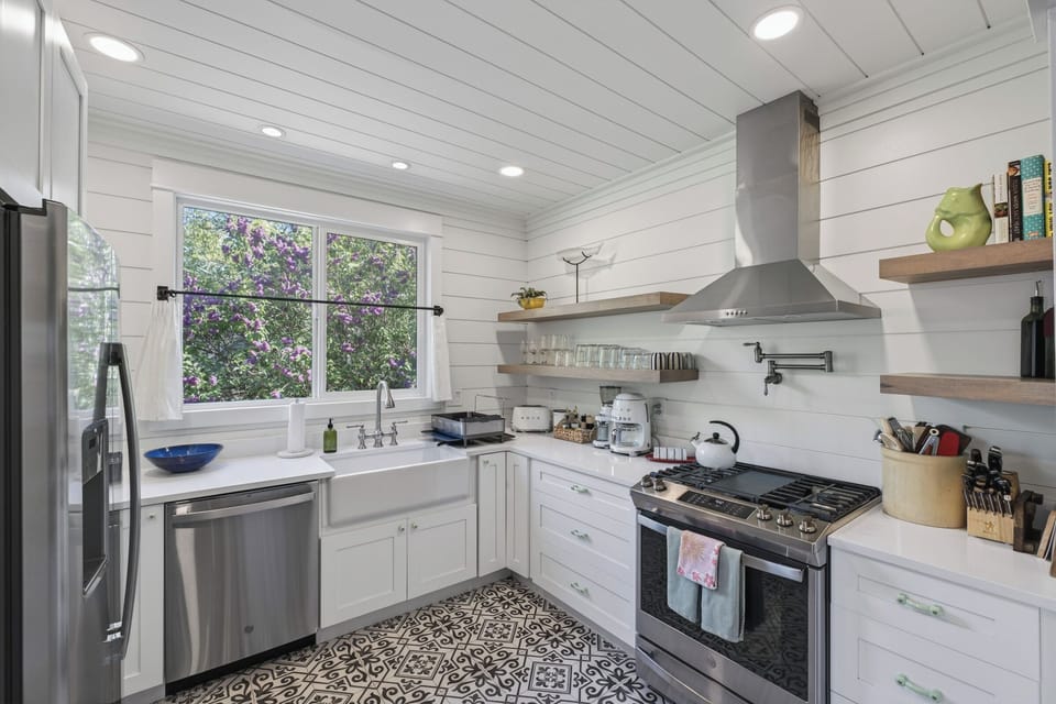 A stylish, fully equipped kitchen ready for coffee, cocktails, & easy home meals