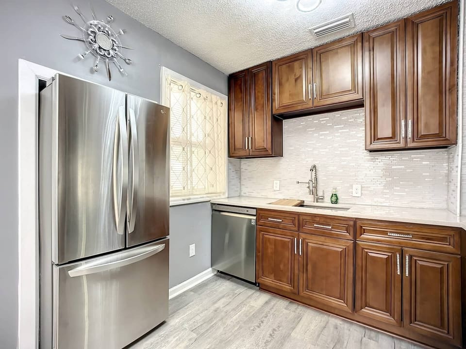 LG appliances, wood cabinets, quartz counter tops.