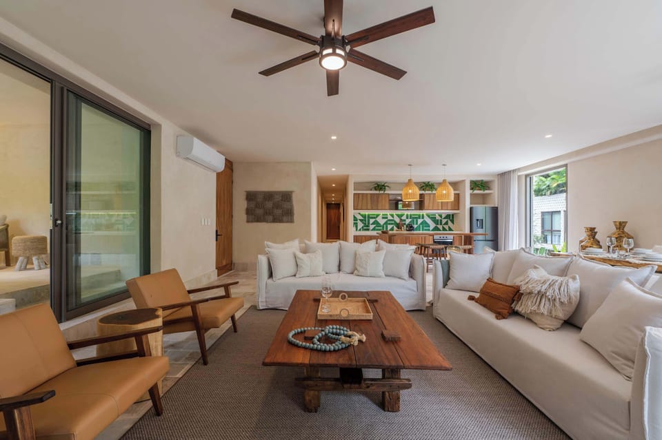 Indoor living that feels connected to the outdoors, surrounded by calming green views.
