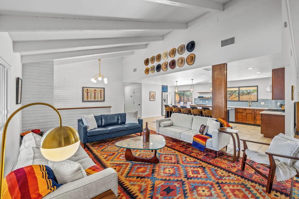 Stylish open-concept living area connecting the cozy lounge space with the fully equipped kitchen.
