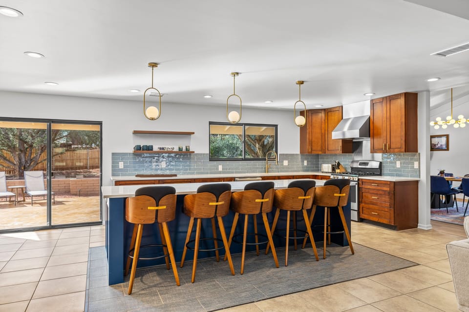 Spacious kitchen featuring a large island with bar seating and an open layout perfect for gathering.