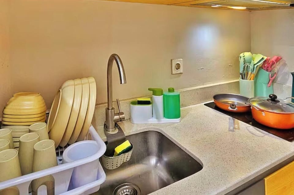 Mini-fridge, stovetop, cookware/dishes/utensils