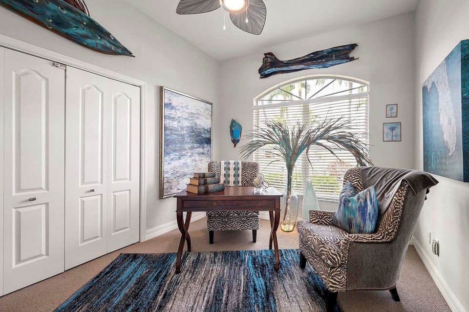 Designated Office Space with Desk and Views of the Garden Separated by French Doors