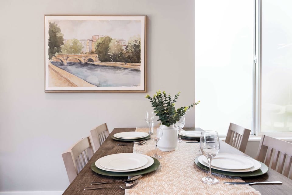 Dining Elegance – Gather around the dining table set for five, complete with stylish décor and a warm, welcoming vibe.