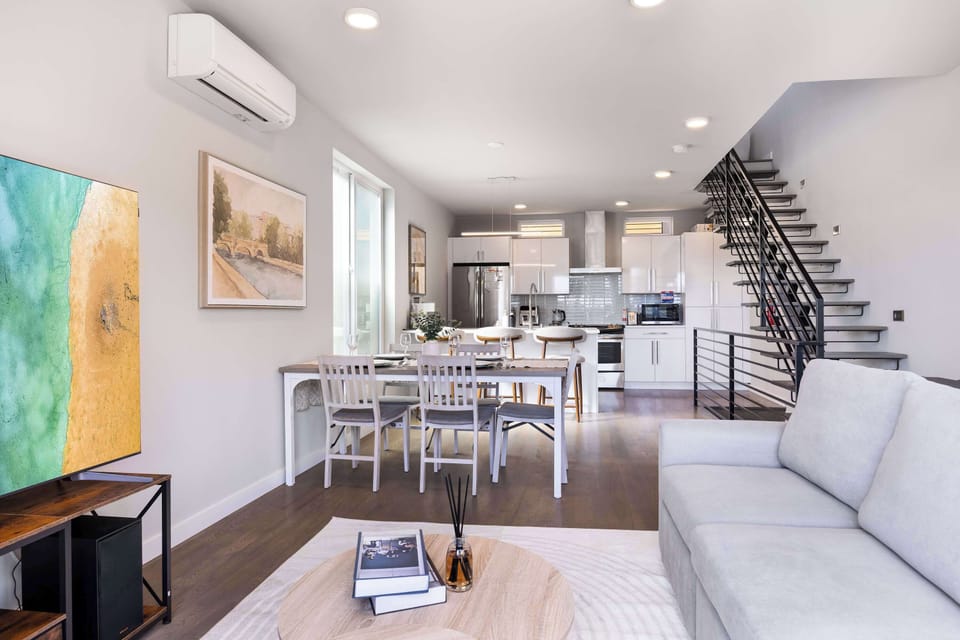 Open-concept living, dining, and kitchen area ideal for gathering with friends or family. Plenty of seating and a fully equipped kitchen make entertaining easy.