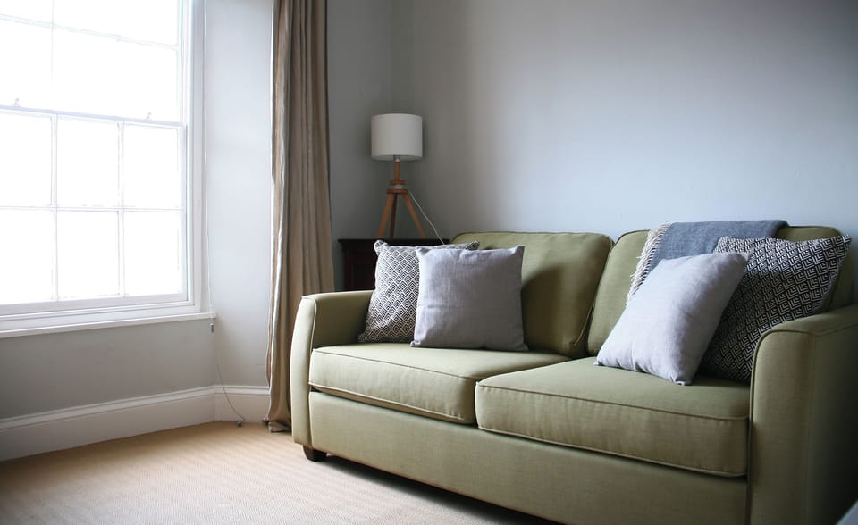 bright bedroom with comfortable John Lewis double bed settee