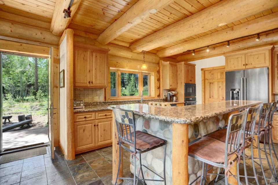 When you are preparing meals in this full functioning kitchen, you feel like you are part of the surroundings with the large picture window.