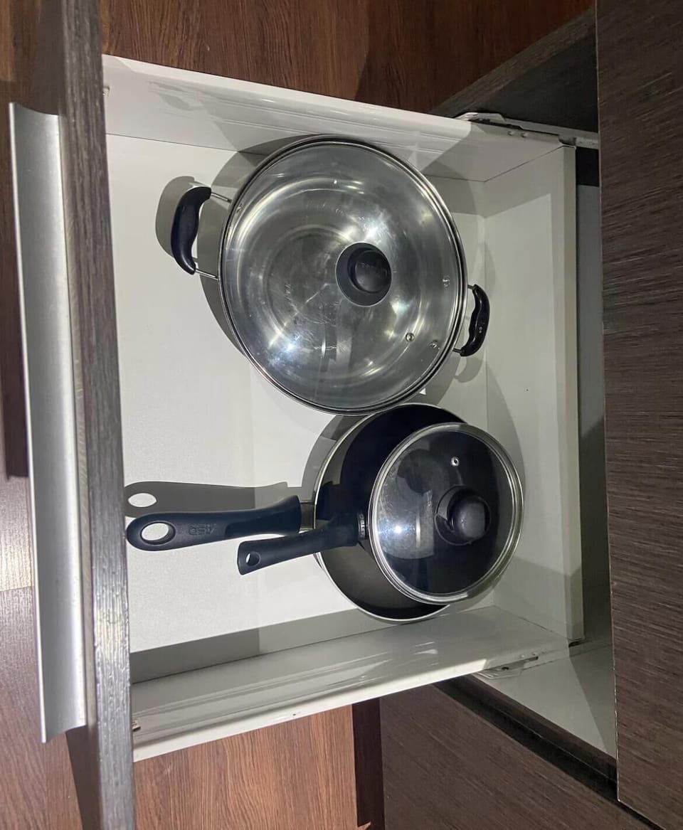 Full-size fridge, microwave, stovetop, cookware/dishes/utensils