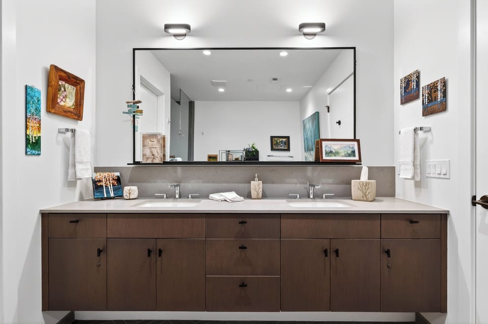 The primary bedroom's ensuite features a shower and a soaking tub.