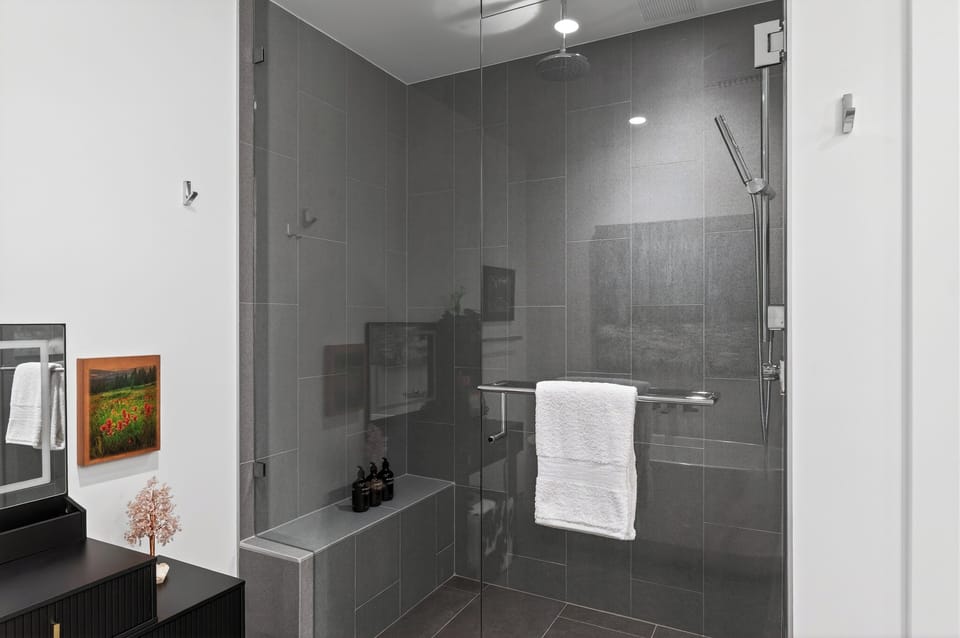 The primary bedroom's ensuite features a shower and a soaking tub.