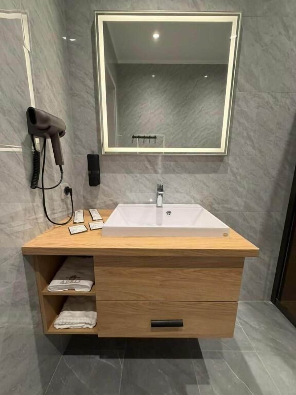 Shower, eco-friendly toiletries, hair dryer, slippers