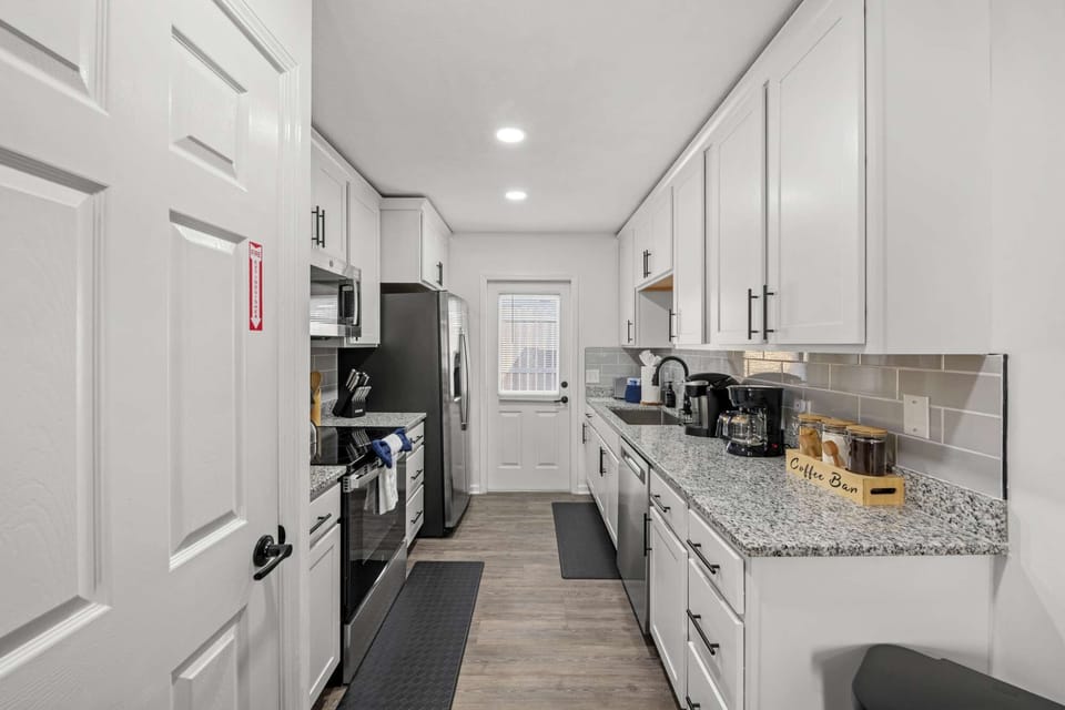 Cook, dine, and unwind in this cozy open-concept kitchen and living area.