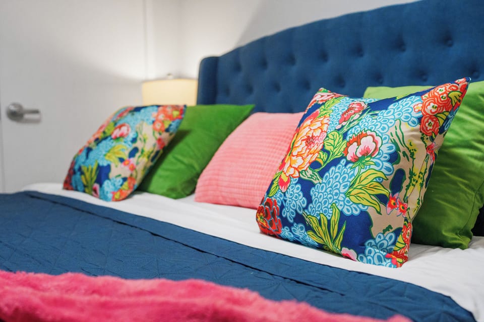 King bed with premium linens — perfect for couples or solo travelers who love extra space.