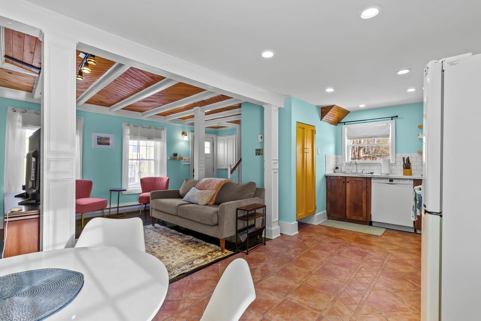 Spacious lounge area with comfy seating and charming character details