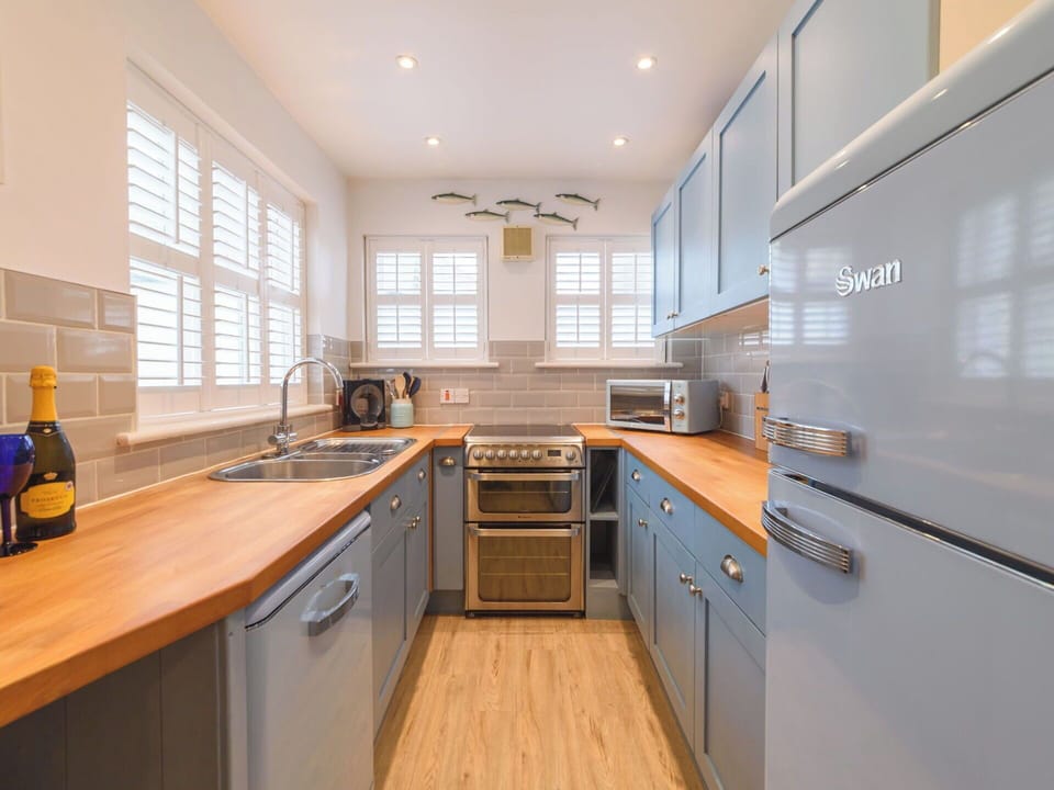 Kitchen, Countertop, Cabinetry, Kitchen Appliance, Interior Design, Major Appliance, Flooring, Furniture, Wood, Home Appliance