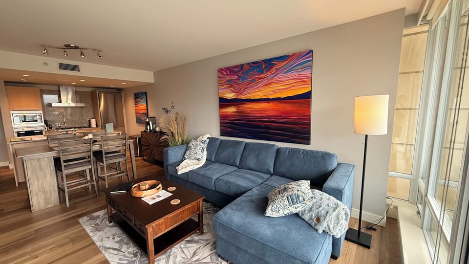 Beautiful living room with art from a local artist.  Pull out queen sofa bed.