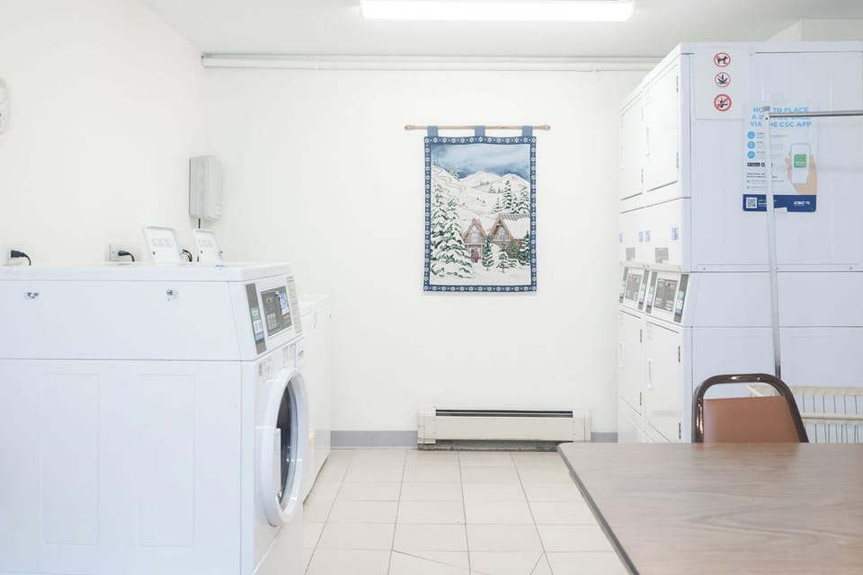 You'll love the convenience of this bright, modern laundry facility with multiple machines and comfortable seating for extended stays.