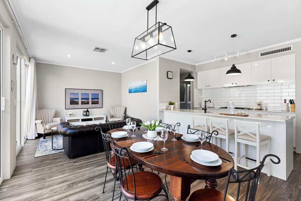 Whether it's a home-cooked feast or local takeout, enjoy your meals under designer lighting in a sophisticated setting.