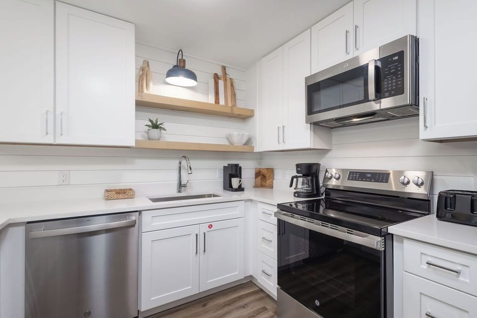 Kitchen - The fully stocked kitchen features both small and large appliances which include both brew style and single k-cup style coffee makers for convenience.