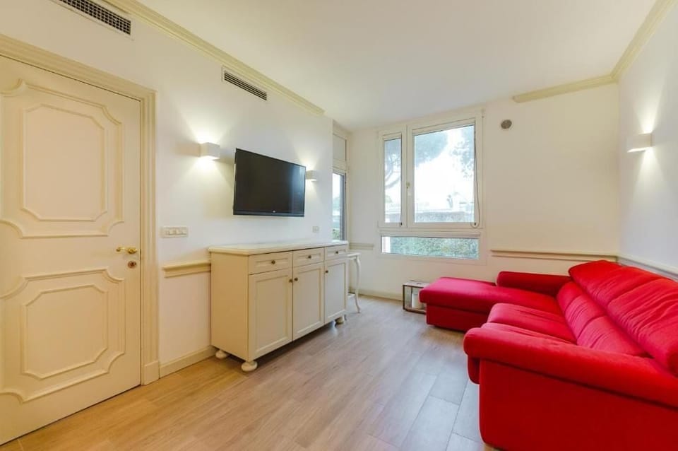 Deluxe Apartment, Courtyard View | Living area | 30-inch flat-screen TV with satellite channels