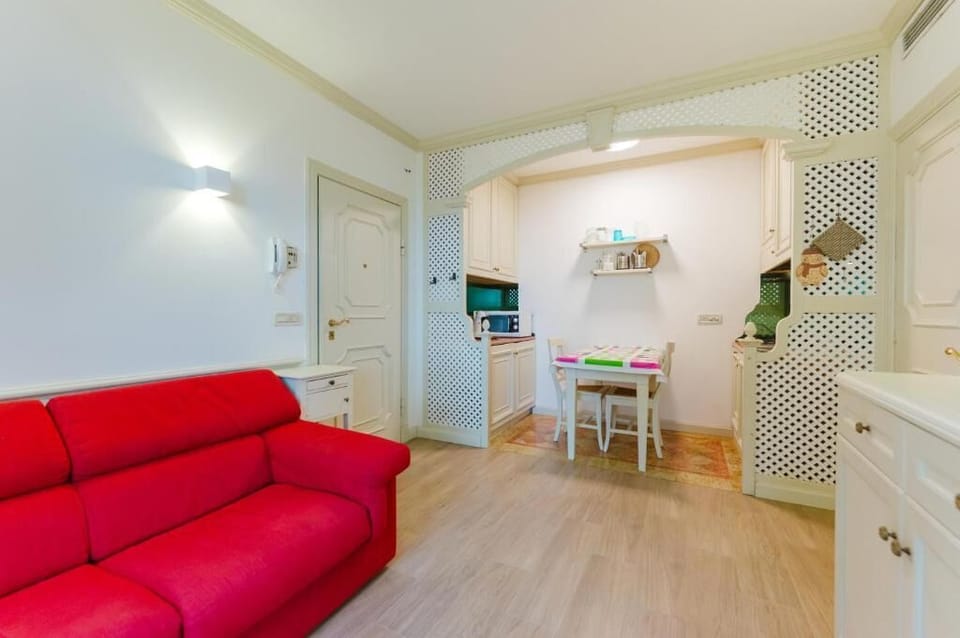 Deluxe Apartment, Courtyard View | Living area | 30-inch flat-screen TV with satellite channels
