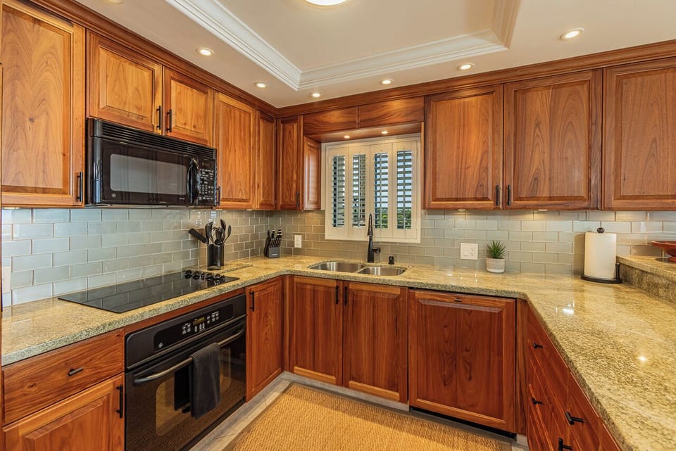 You'll love cooking in this elegant kitchen with granite countertops, cherry cabinets, and all the appliances you need for memorable meals.