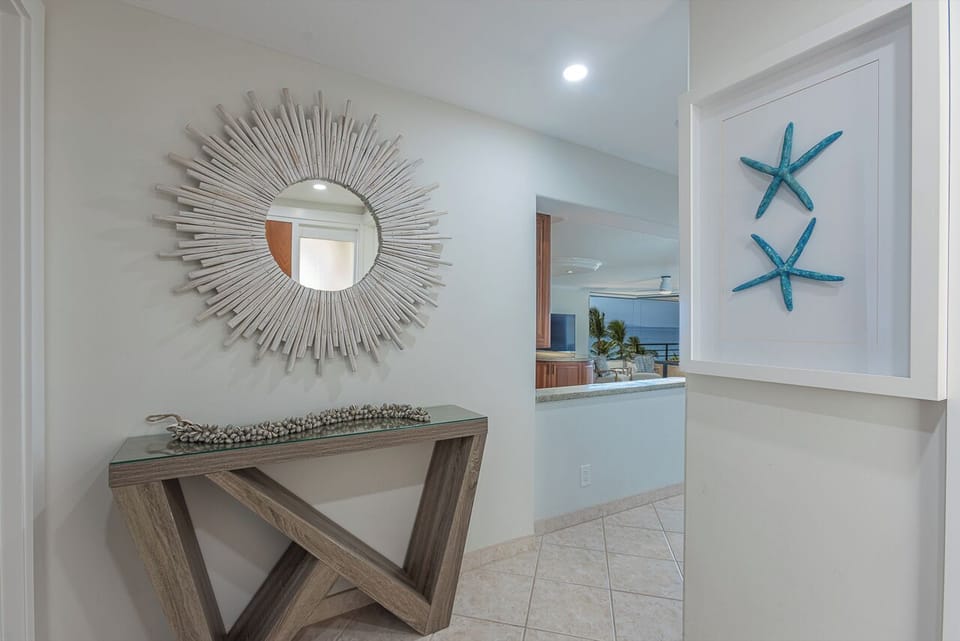 Step into your coastal retreat where elegant décor and ocean views create the perfect welcome home feeling.