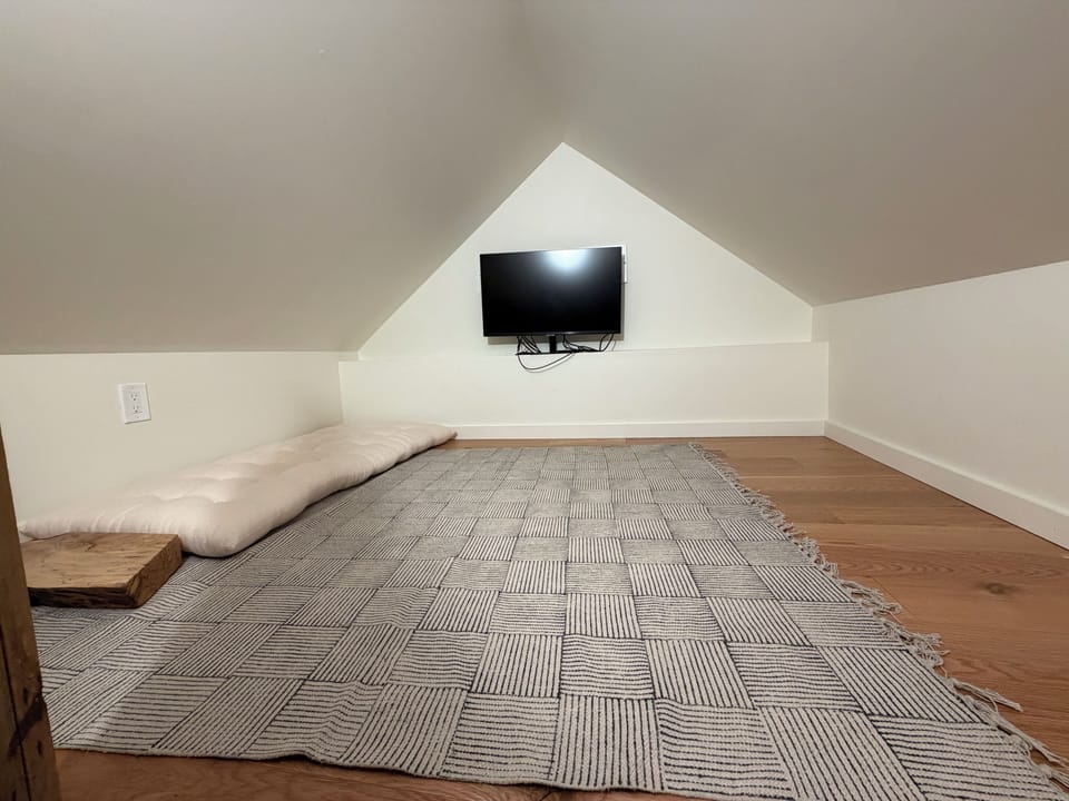 Kids' Loft - Low ceiling, accessible by ladder.