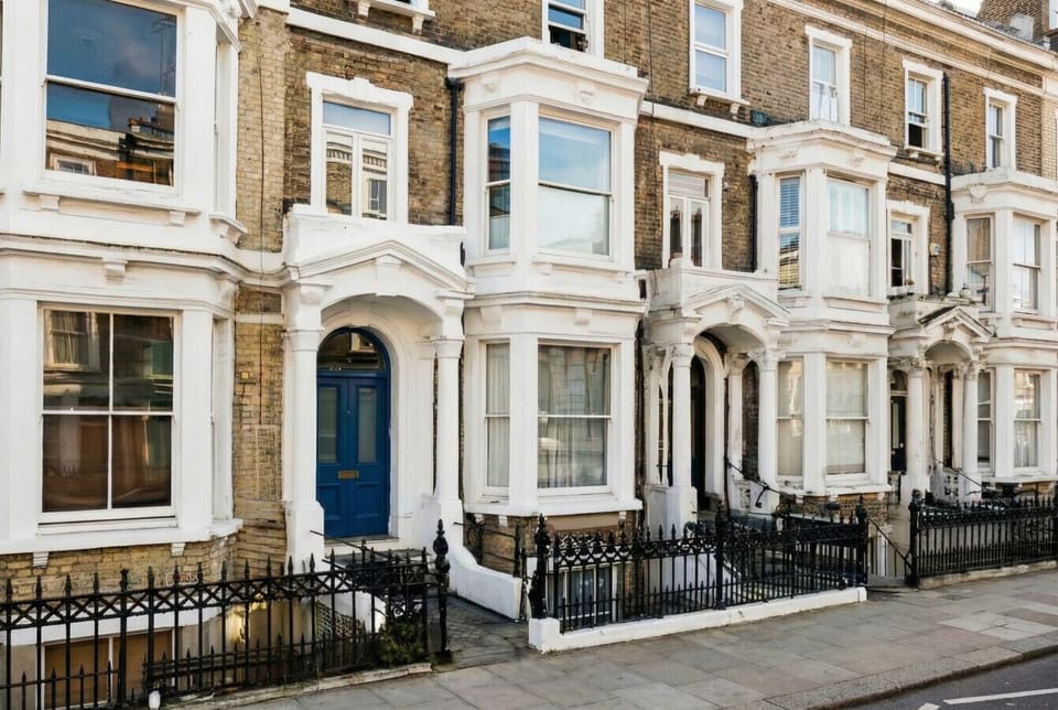 Classic Victorian terrace with iconic blue front door just two minutes from West Kensington tube.