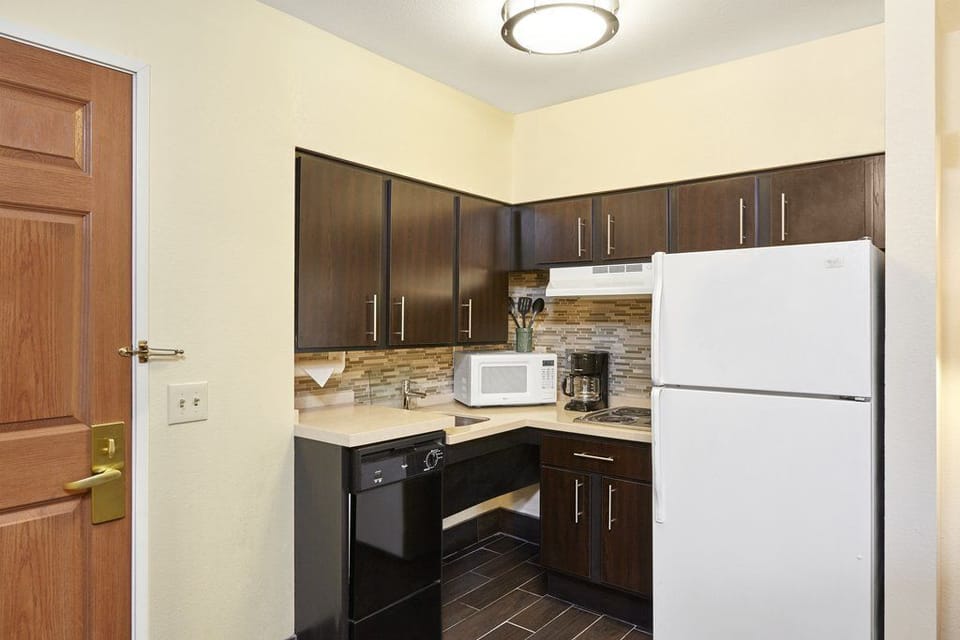 Prepare meals effortlessly with ample counter space and convenient kitchen amenities.