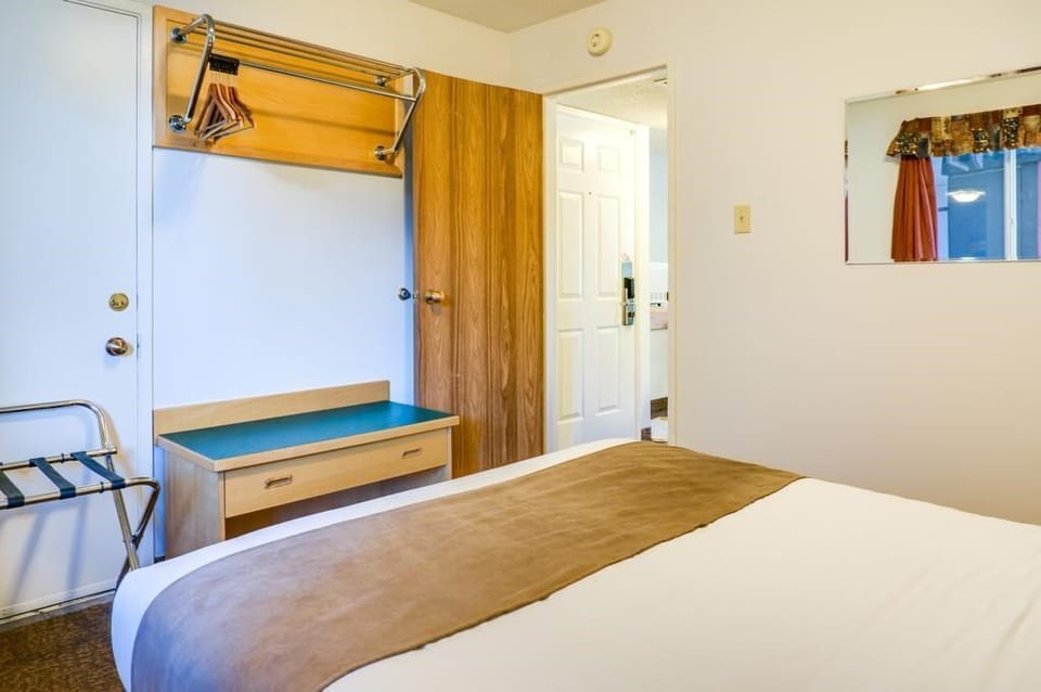 The bedroom is nicely decorated and has plenty of room.