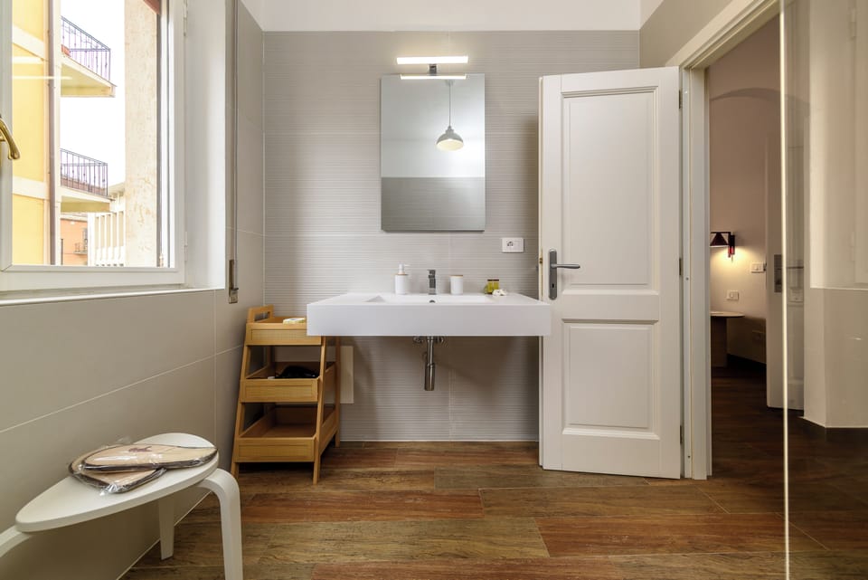 Quadruple Room, Balcony | Bathroom | Shower, hair dryer, bidet, towels