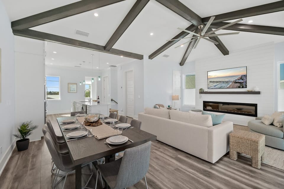 Spacious open living and dining area with vaulted ceilings and ocean views from the second floor