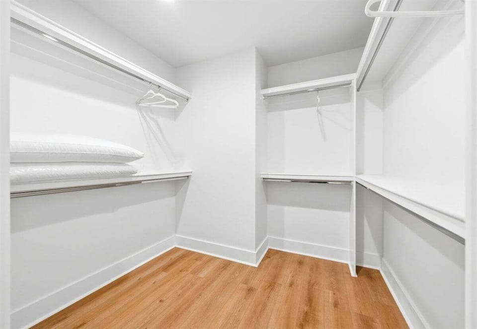 Generous shelving and hanging space in the walk-in closet make it easy to keep belongings organized during your stay.
