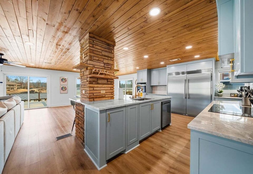 Clean lines, modern appliances, and plenty of counter space make this kitchen both stylish and practical for preparing meals for a group.