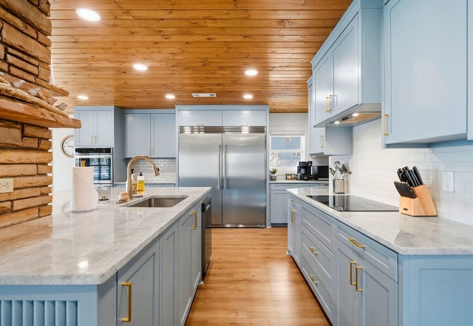 The spacious kitchen layout includes generous prep areas and updated appliances, giving everyone plenty of room to cook and move around comfortably.