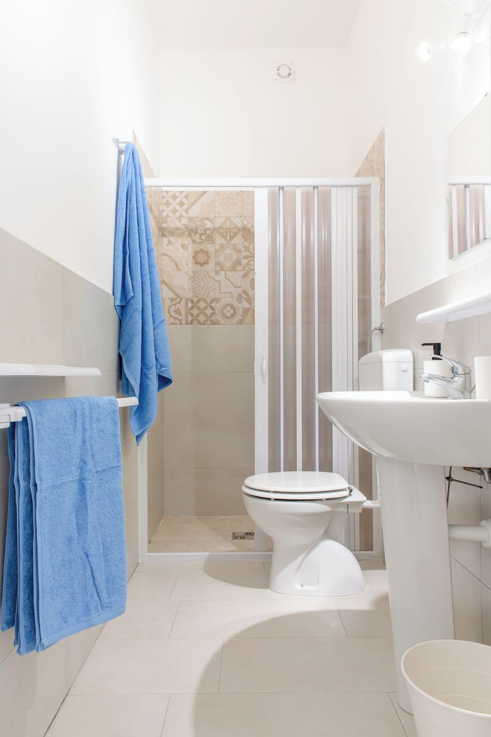 Shower, hair dryer, bathrobes, towels