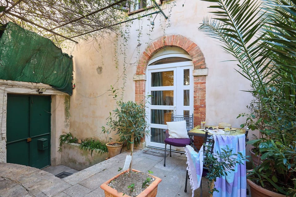 Step out into front terrace, a charming stone-paved nook perfect for soaking up the historic atmosphere.