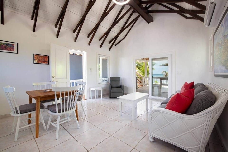 Living area with a view of the Sea outside the patio doors. 