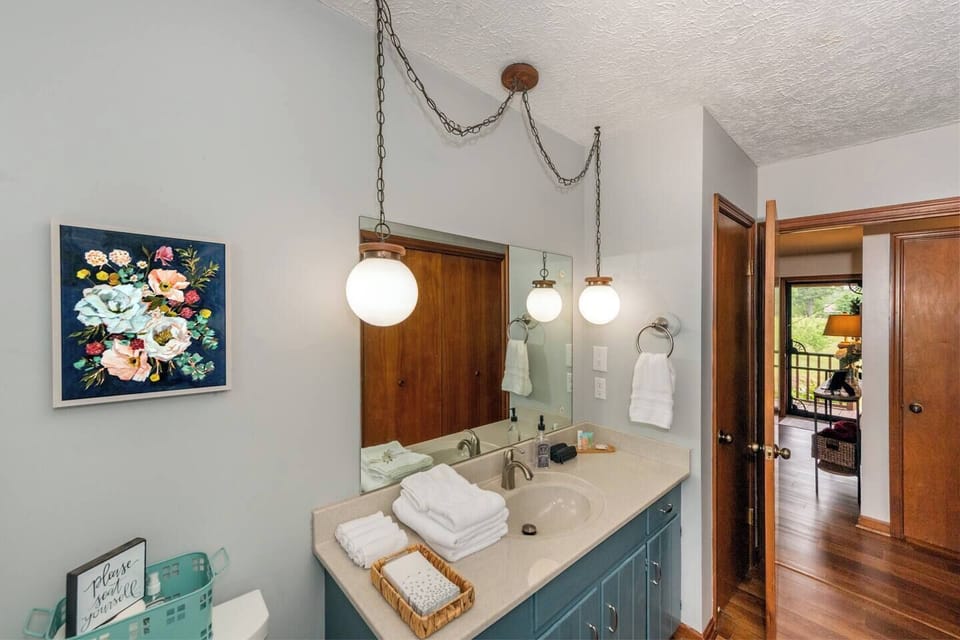 Bathroom Bliss: Elegant fixtures and natural light create a refreshing retreat for your stay!