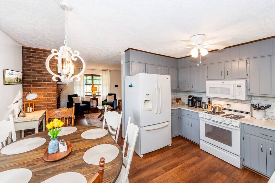 Dining Area: Bright space with a charming table, perfect for family meals and game nights!