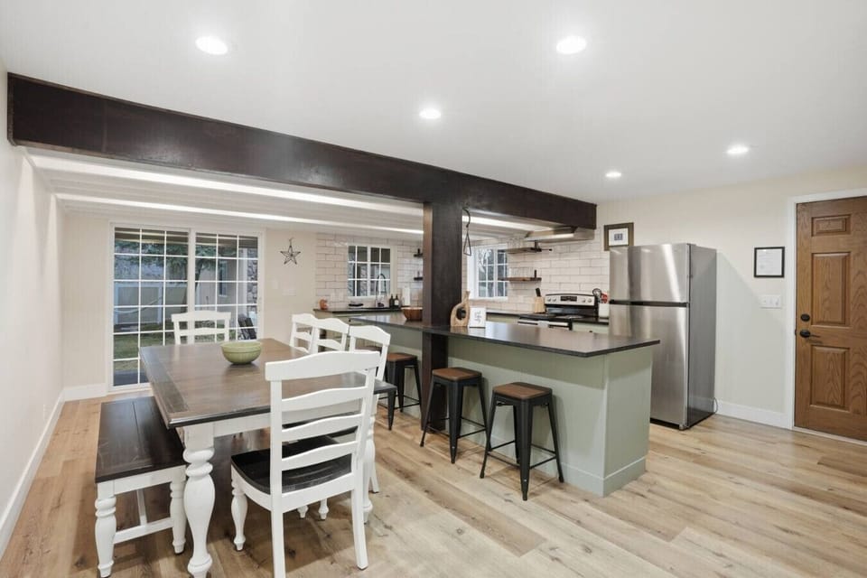 Open kitchen and dining area with island seating for four